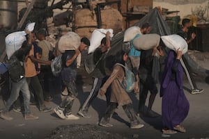 Israel allows aid to trickle into Gaza after widespread condemnation of blockade